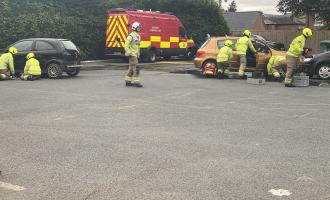 Firefighters performing a road traffic collision drill