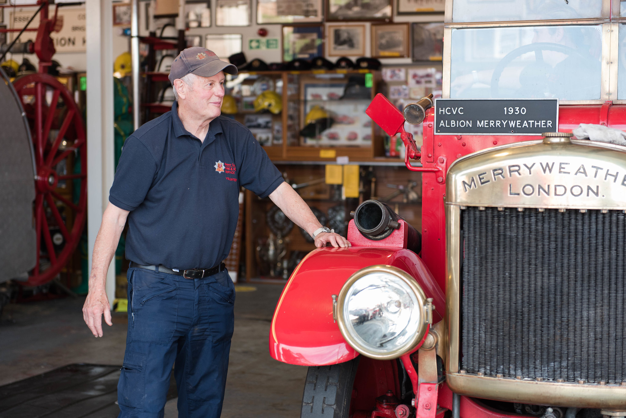 One of our museum volunteers looking after a red 1930s Merryweather fire engine.