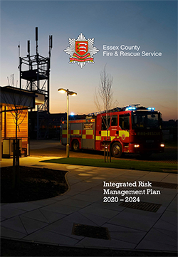 Front cover of the IRMP document - a fire station at night