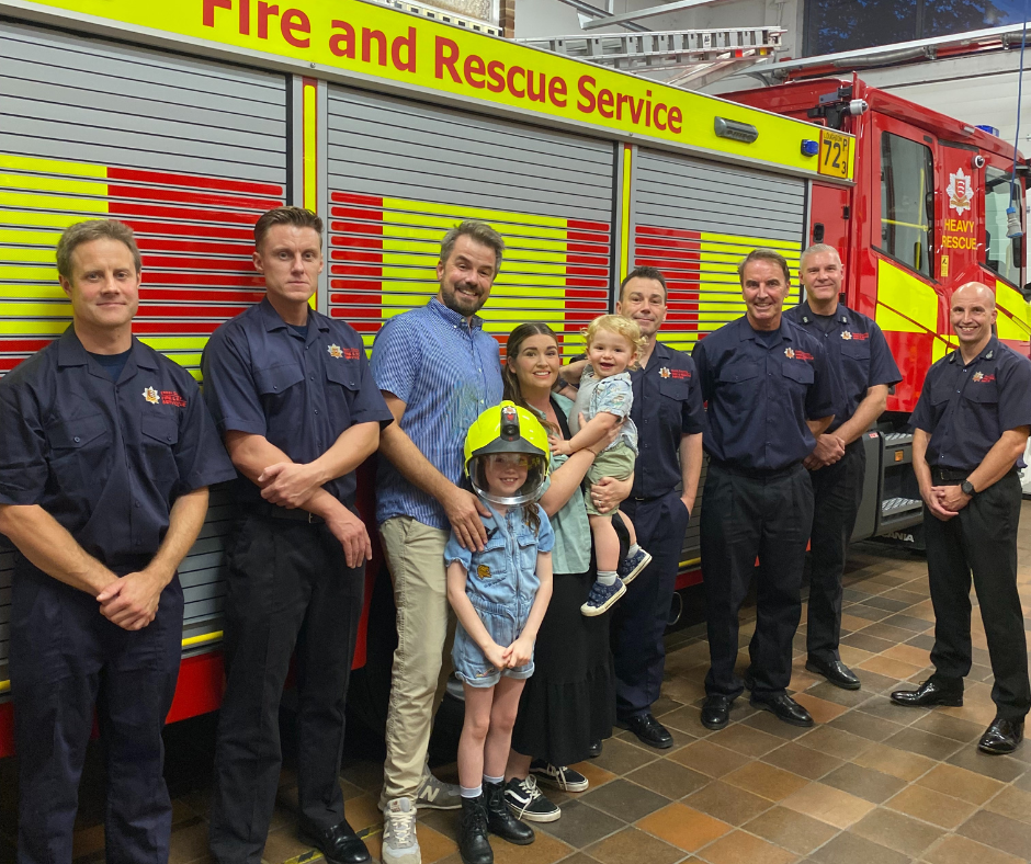 Firefiighters from Loughton Blue Watch with Draper family