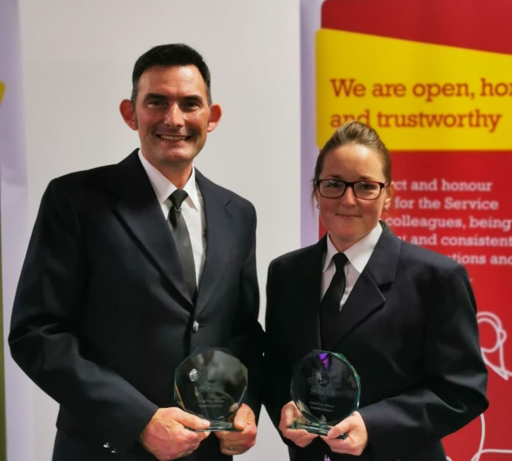 Paul Brazier (left) and Claire Speed (right) holding CFO Commendation Awards