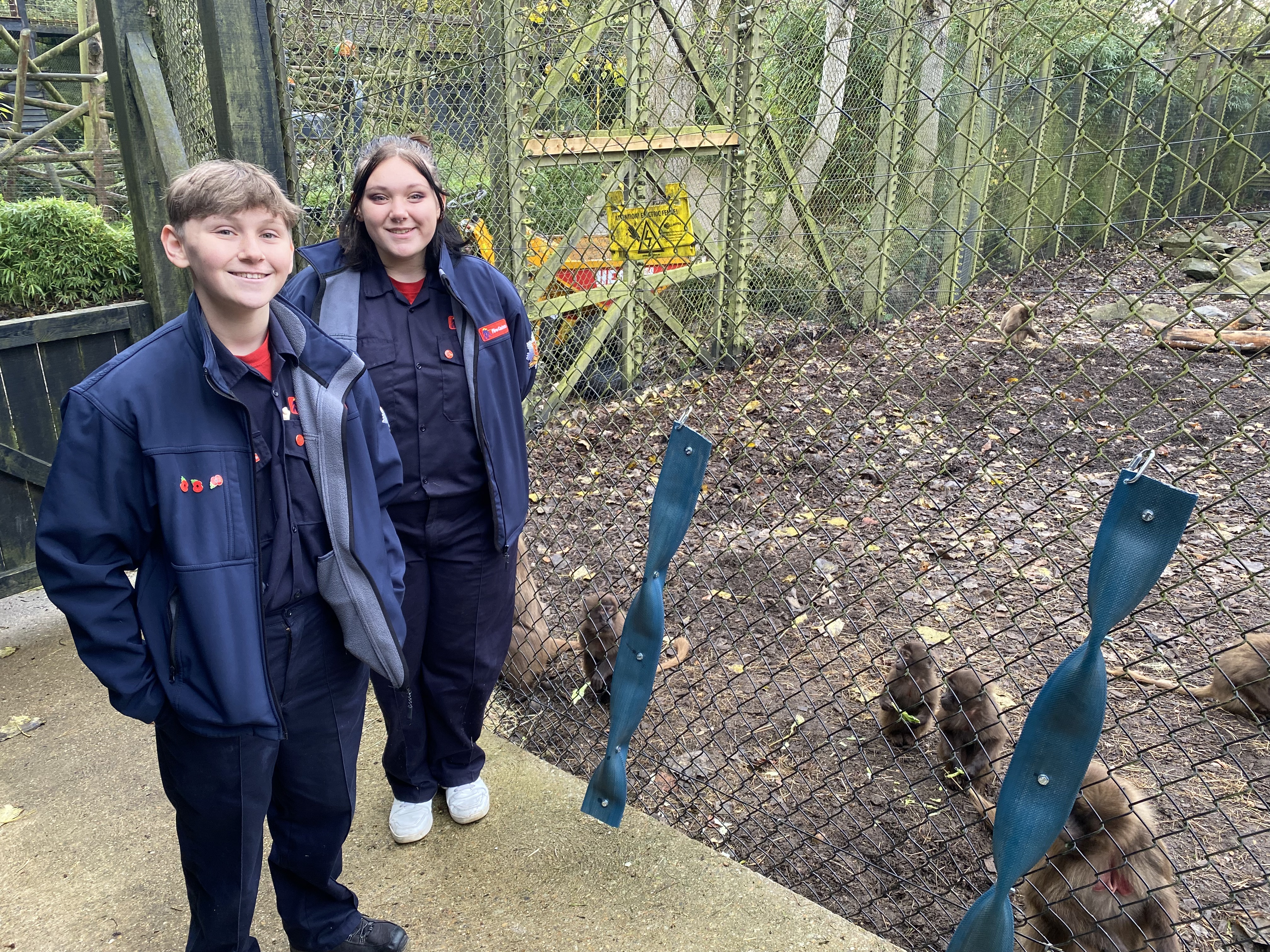 Zak and Jorge with puzzle feeders made from old fire hoses for Gelada Baboons at Colchester Zoo