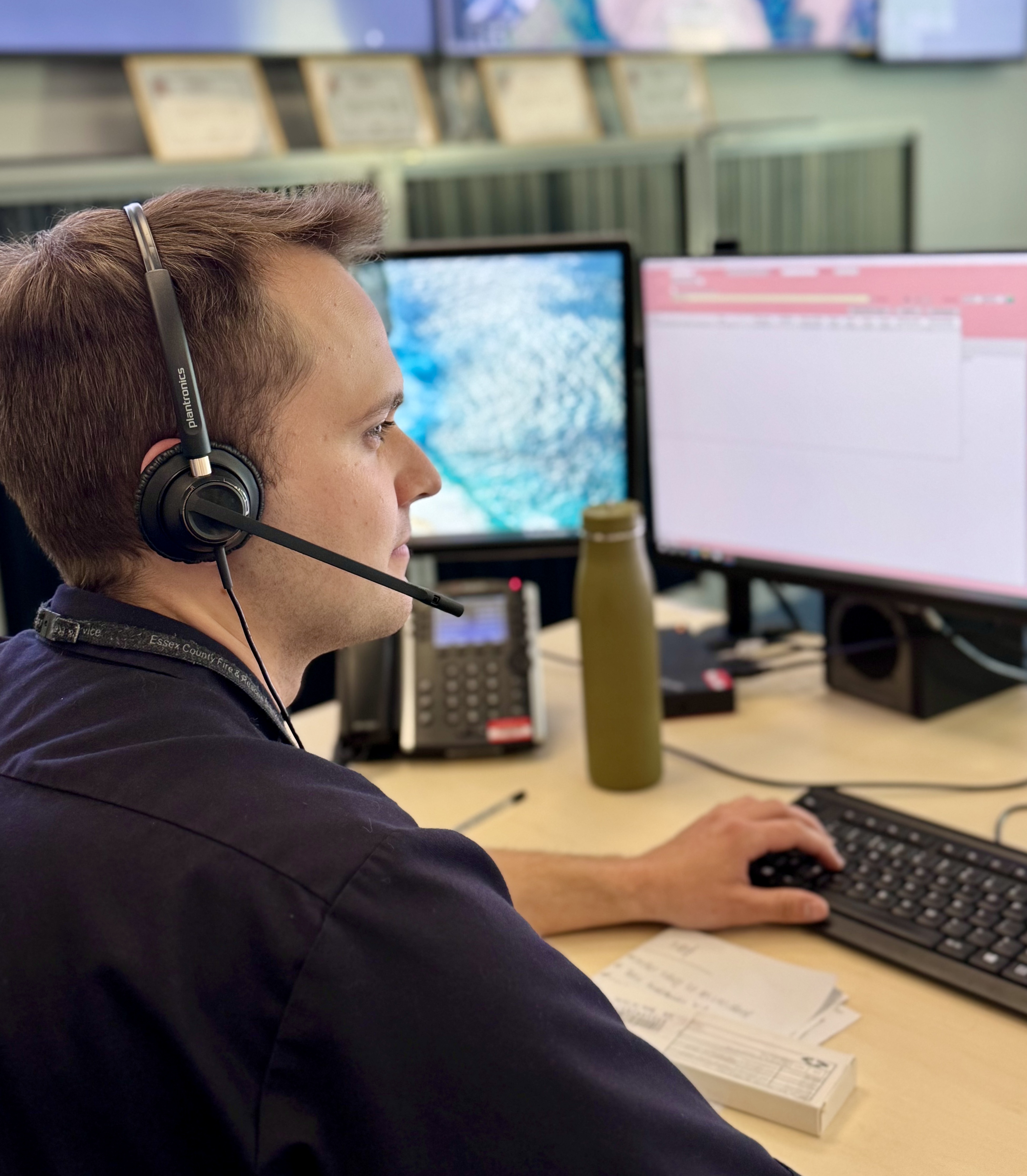 Jacob, control operator, sitting at desk in Control