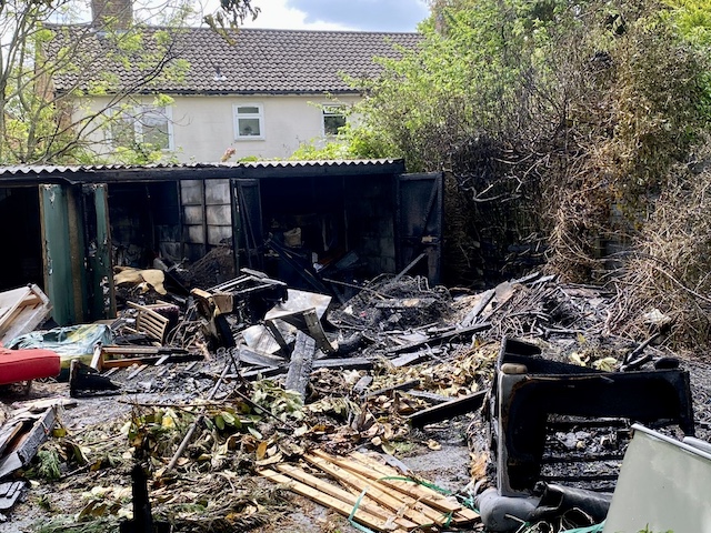 burnt out garages following fire