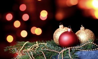 Gold and Red baubles surrounded by Christmas lights with gold beads