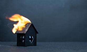 Model House with roof on fire