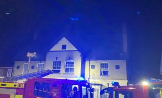 Fire engines outside a three-storey block of flats