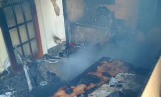 A fire damaged door and kitchen