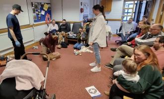 Firefighters giving first aid training inside fire station