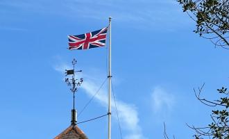 The Union Jack flag flying above Lawford Church