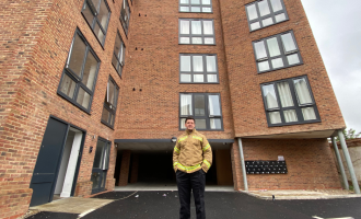Jim Palmer standing in front of Amleen House Colchester