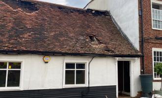 Single storey extension with damage to roof