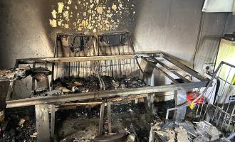 A burnt living room after a candle fire