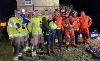 Cora reunited with her owner and the firefighters who helped to rescue her