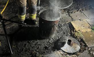 Firefighters extinguishing a fire in an incinerator