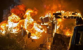 Eight lorries on fire in a yard