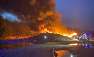 Large pile of textiles on fire
