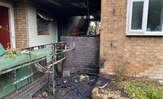 Fire damaged walkway outside flats