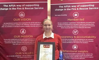 Director of People Service, Colette Black holding award