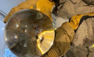 Firefighter holding glass globe