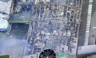A drone image of a warehouse on fire