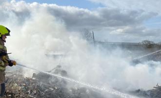 Firefighter tackling fire