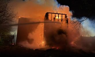 Water being sprayed on a burning building