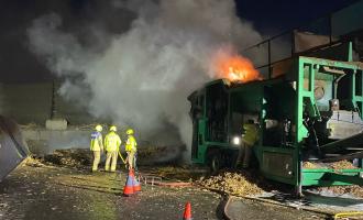 An outside fire with three firefighters