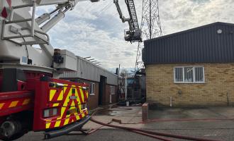 An Aerial Ladder Platform at the scene of an industrial unit fire