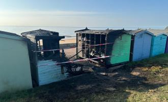 Beach huts destroyed by a fire