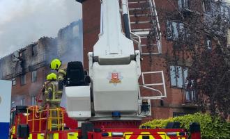 Aerial lader platform in operation at building fire