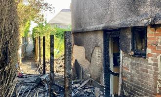 House and garden badly damaged by fire