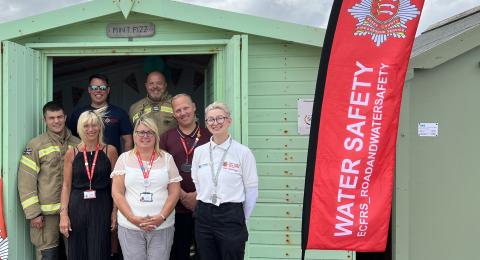 ECFRS staff with CVST staff in front of beach hut in Clacton