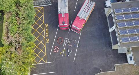 An aerial shot of two fire engines and the words "Open Day"