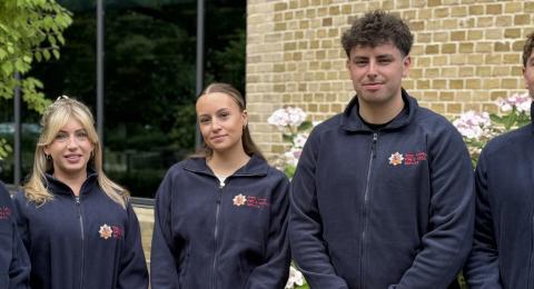 Our five new apprentices standing in front of our HQ