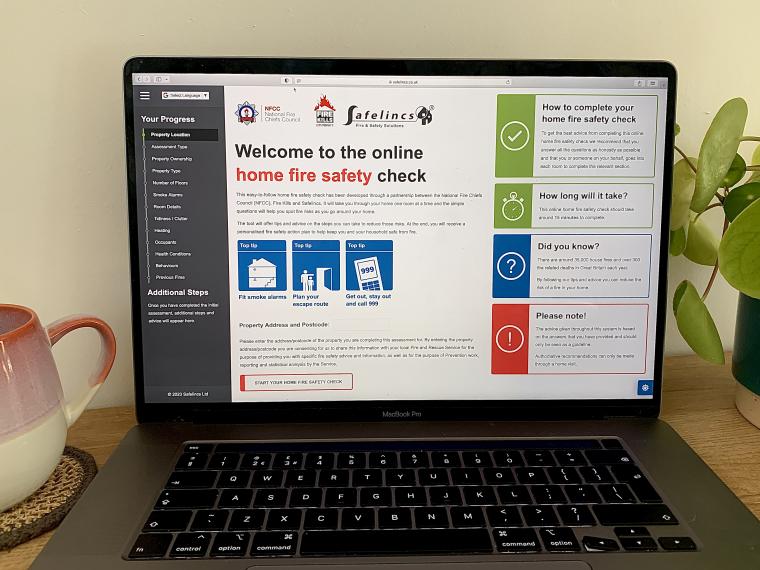 A laptop with the online home fire safety check page open