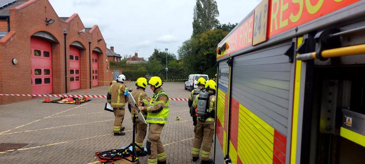 Firefighters and a fire station