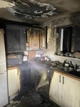 A fire damaged kitchen following a tumble dryer fire
