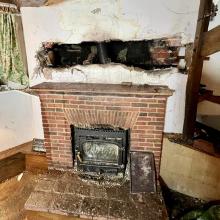 Photo of a fire damaged chimney breast
