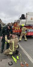 Firefighters working with ambulance colleagues to use an Aerial Ladder Platform 