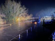 car stuck in flooded ford