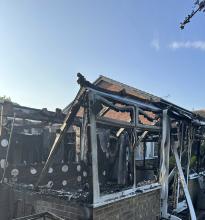 A burnt outbuilding after a BBQ fire