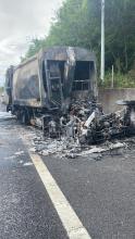 A bin lorry on fire on the M25