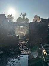 A burnt outbuilding after a BBQ fire