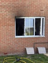 Smoke damaged windows on a ground floor flat