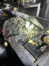 A burnt grill after a grease fire