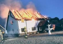 The roof of a house on fire