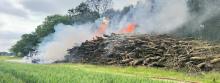 Smoke and fire coming from a woodpile
