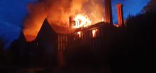A derelict building on fire
