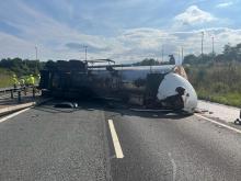 An overturned lorry on the M11